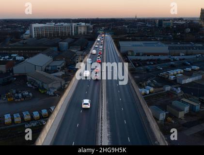 Aerial view of traffic leaving a city on a freeway overpass at night during the evening rush hour Stock Photo