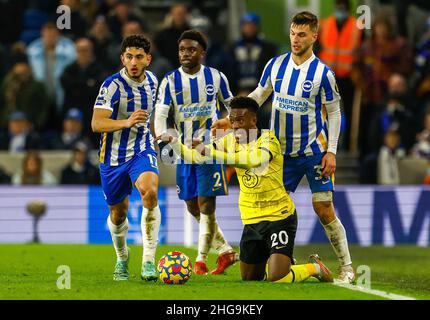 Chelsea’s Callum Hudson-Odoi tackled by Brighton and Hove Albion's Steven Alzate (left), Tariq Lamptey and Joel Veltman (right) in action during the Premier League match at the AMEX Stadium, Brighton. Picture date: Tuesday January 18, 2022. Stock Photo
