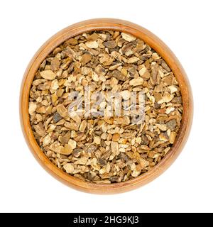 Dried porcini in a wooden bowl. Flakes of Boletus edulis, known as cep, penny bun or porcino. Edible mushrooms, held in high regard in cuisines. Stock Photo