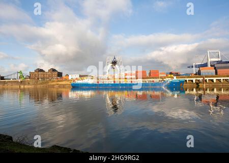 Krefeld - View to Container-Terminal with huge Cranes, where reflections on the water in Wintertime, North Rhine Westphalia, Germany,18.01.2022 Stock Photo