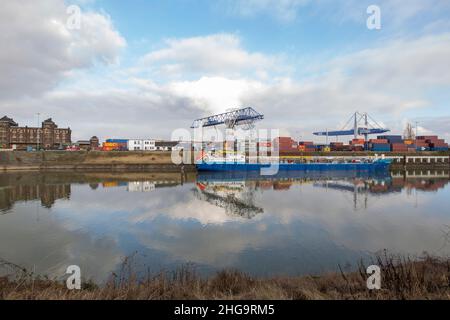 Krefeld - View  to Container-Terminal with huge Cranes for heavy Load with reflections on the water, North Rhine Westphalia, Germany, 18.01.2022 Stock Photo