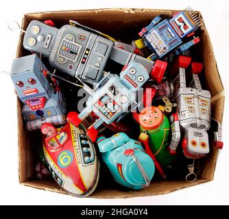 a box of retro toy robots taken from above isolated on white Stock Photo