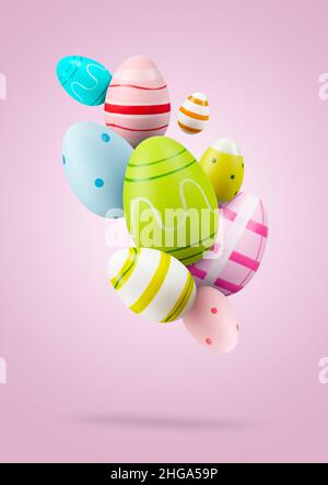 Easter eggs. Group of colored easter eggs jumping on pink background Stock Photo