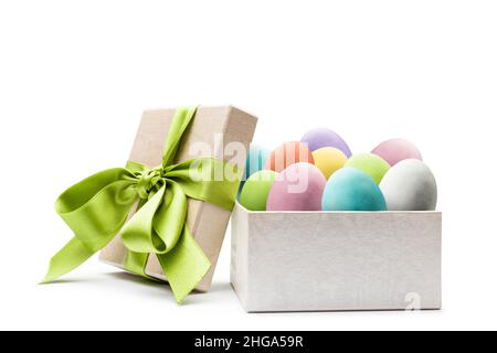 Colorful easter eggs into gift box, on white background Stock Photo