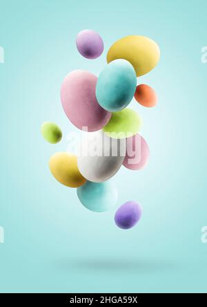 Easter eggs. Group of colored easter eggs jumping on blue background Stock Photo