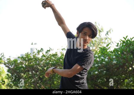 indian young boy through a ball Stock Photo