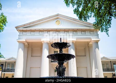 Little Rock, USA - June 4, 2019: Old State House Museum old capitol building with neoclassical columns architecture and water fountain looking up blue Stock Photo