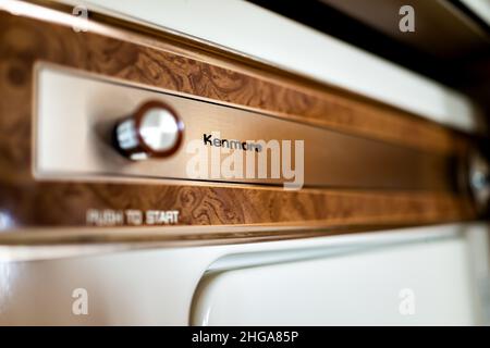 Charlottesville, USA - October 26, 2020: Old retro vintage electric oven  stove with stainless steel knobs dials closeup in kitchen by Kenmore  company Stock Photo - Alamy