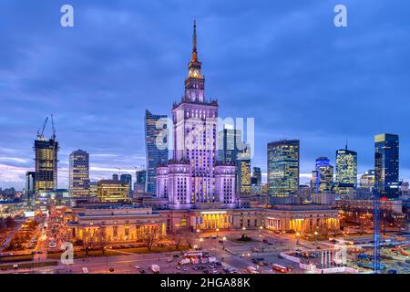 Warsaw, Poland - January 22, 2020: High angle view panorama of Warszawa cityscape skyline with centralna train station and palace of culture night eve Stock Photo