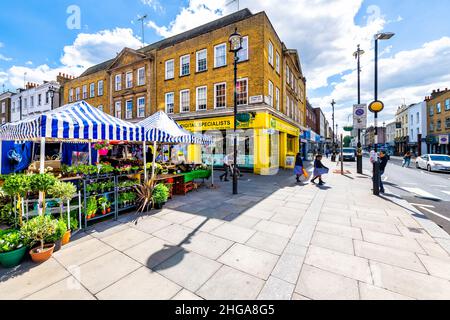 London, UK - June 21, 2018: Neighborhood of Pimlico in Victoria with Tachbrook street food farmers market in downtown with stall stand vendors and sig Stock Photo