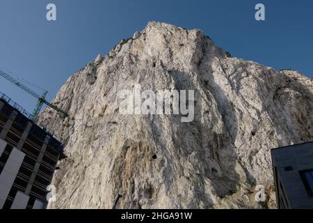 The Rock of Gibraltar and building construction works viewed from Devil's Tower Road, Gibraltar, July 2021 Stock Photo