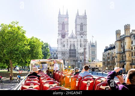 London, UK - June 22, 2018: Point of view pov riding Big Bus guided tour in London summer chairs seats view of Westminster Abbey church building Stock Photo