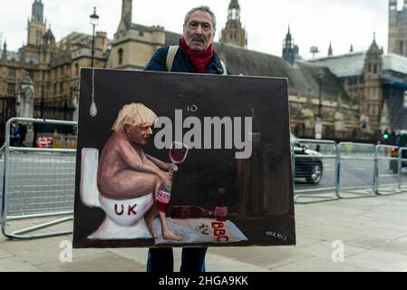 London, UK.  19 January 2022.  Satirical artist Kaya Mar in front of the Houses of Parliament presenting his latest work depicting Boris Johnson.   The Prime Minister is facing pressure from MPs as well as members of his own party to resign following the discovery that parties had taken place in Downing Street at a time when such activities were banned. Credit: Stephen Chung / Alamy Live News Stock Photo