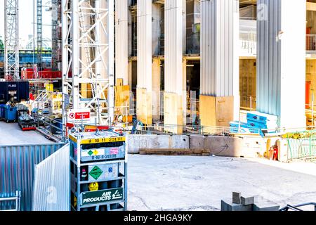 London, UK - June 22, 2018: High angle view on York street road in London Waterloo with construction workers at site scaffold warning signs by modern Stock Photo