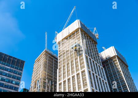 London, UK - June 22, 2018: Southbank riverside place luxury buildings apartment flats under construction with many cranes on modern skyscrapers low a Stock Photo