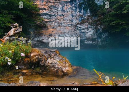 Beautiful view of turquoise lake in mountains. Calm landscape. Bay in mountains. Stock Photo