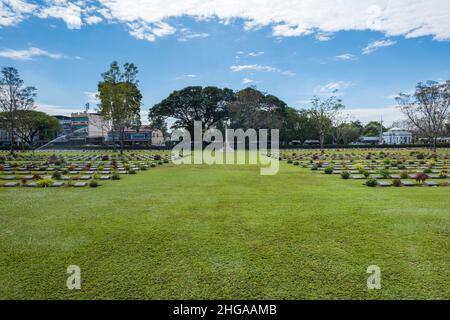 Kanchanaburi, Thailand - December 2021: The Kanchanaburi War Cemetery (known locally as the Don-Rak War Cemetery), the main prisoner of war (POW) Stock Photo