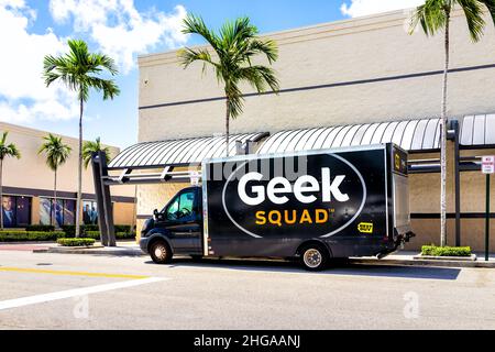 Miami, USA - July 18, 2021: Sign advertisement for Best Buy store Geek Squad repair van truck in parking lot in Florida with palm trees on sunny day Stock Photo