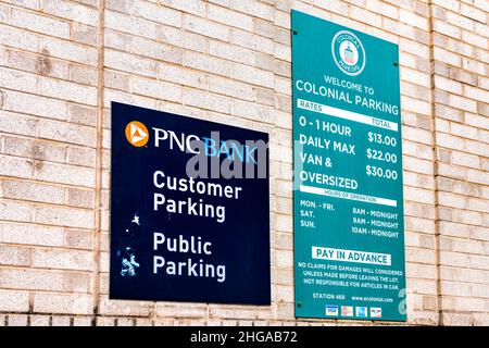 Washington DC, USA - August 18, 2021: Georgetown M street with PNC bank entrance sign on wall closeup for customer public colonial parking with rates Stock Photo