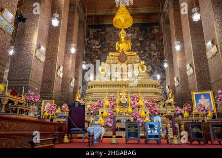 Bangkok, Thailand - December 2021: Golden Buddha Statue in Wat Po Interior, in Bangkok, Thailand, a famous landmark in Bangkok Stock Photo