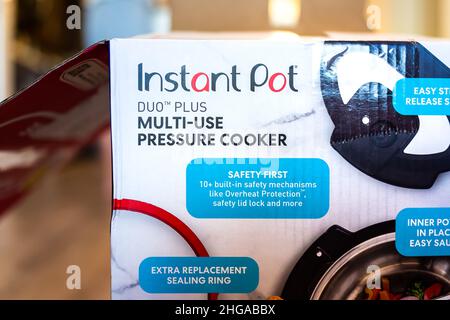 Naples, USA - August 25, 2021: Instant pot brand sign closeup of famous pressure cooker called Duo Plus with multi-use function package box delivery Stock Photo
