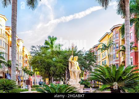 Naples, USA - September 13, 2021: Naples, Florida Bayfront street condo architecture building colorful multicolored cityscape with water fountain stat Stock Photo
