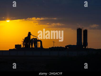 Cement factory in the sunset, Jazan Province, Farasan, Saudi Arabia Stock Photo