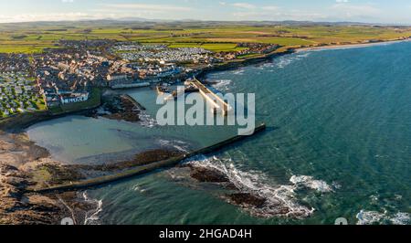 Aerial view from drone of Seahouses fishing harbour in Northumberland ...