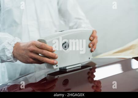 Hands of male car mechanic selecting wrench from tool box in repair garage  Stock Photo - Alamy