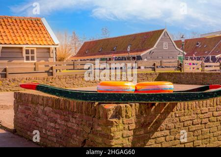 Zaanse schans, Netherlands - April 1, 2016: Holland cheese rounds souvenirs in old traditional dutch village Stock Photo