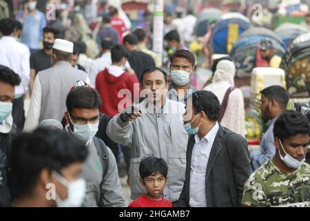 Some people wear no masks amid crowds defying government orders in the New Market area despite a surge in coronavirus infections, in Dhaka, Bangladesh, January 19, 2022. Bangladesh reported 12 more Covid-linked deaths with 9,500 fresh cases in 24 hours till Wednesday morning following a continuous rise in its infection rate. The positivity rate in the country further increased to 25.11 per cent from Tuesday’s 23.98 per cent after testing 37,573 samples, according to the Directorate general of health Services (DGHS). Photo by Suvra Kanti Das/ABACAPRESS.COM Stock Photo