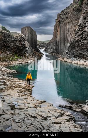 Tourist at Stuolagil Canyon, basalt columns, Egilsstadir, Iceland Stock Photo