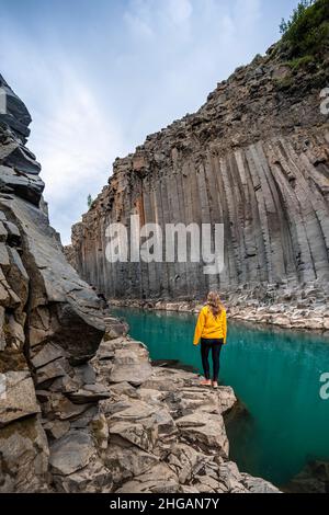 Tourist at Stuolagil Canyon, basalt columns, Egilsstadir, Iceland Stock Photo