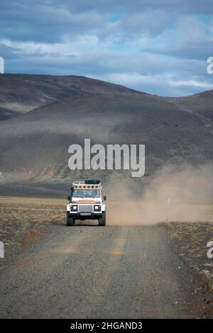 Land Rover Defender on gravel road, barren landscape, Icelandic ...