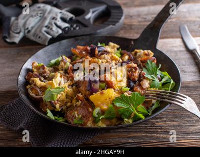 Bodybuilding meal for muscle gain with roasted potatoes, low fat ham, red onions, scrambled eggs and scallion. Stock Photo
