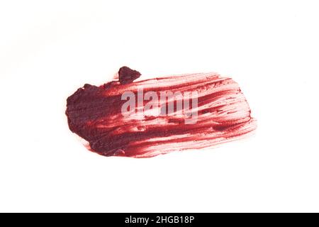 The smear and texture of lipstick. The pink color is highlighted on an isolated white background. An element for beauty cosmetic design. High quality photo