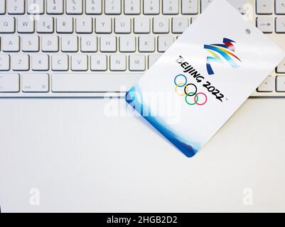 Beijing, China, October 2021: Blank white badge with the Beijing 2022 winter olympic games logo artwork on a computer keyboard. International event. Stock Photo