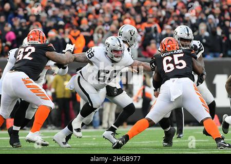 Las Vegas Raiders center Andre James walks with trainers after an