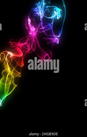 A colorful smoke spiral pattern in rainbow gradient colours on black background. Stock Photo