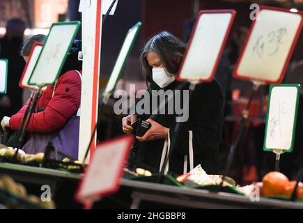 Frankfurt, Germany. 19th Jan, 2022. A customer shops at a market in Frankfurt, Germany, on Jan. 19, 2022. Germany's annual inflation rate reached 3.1 percent in 2021, the highest level since 1993, the Federal Statistical Office (Destatis) announced on Wednesday. Credit: Lu Yang/Xinhua/Alamy Live News Stock Photo