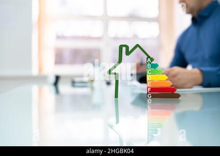 Energy Efficient House Audit Using Calculator. High Efficiency Stock Photo