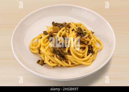 Italian spaghetti alla chitarra with turnip tops, homemade fresh pasta from Abruzzo and Puglia Stock Photo