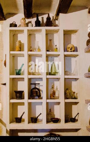 Old glass flasks and bottles in cubicles in the apothecary of the monastery of Santo Domingo de Silos, Burgos, Castilla y León, Spain. Stock Photo