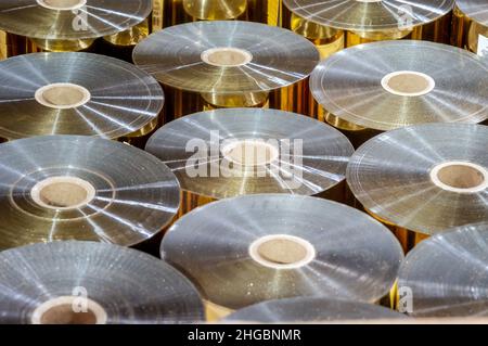 Foil in the printing shop. Aluminum technical foil. Rolls of foil for embossing. Stock Photo