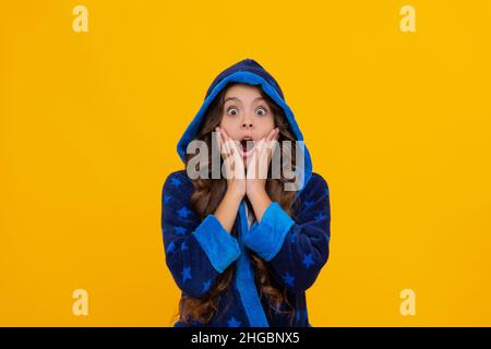 Shocked expression. Shocked child keeping dropped jaw with hands. Showing shock or great surprise Stock Photo