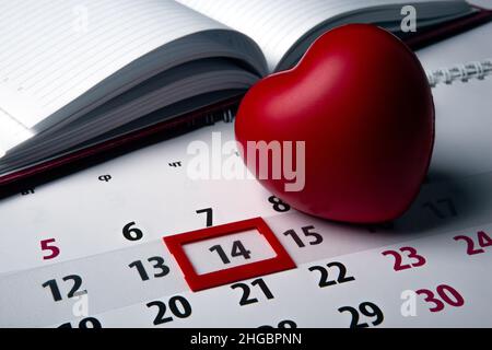 14 february and one large red on a wall calendar with date close up Stock Photo