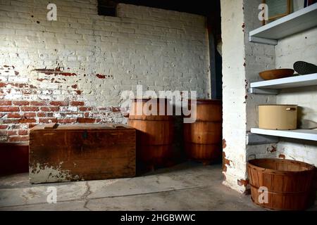 Vintage Cellar with Barrels, Trunk and Brick Wall Stock Photo