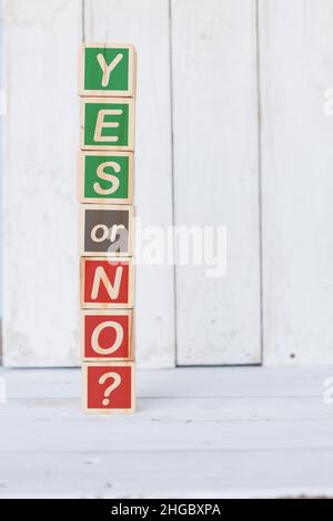 wooden cube, with with word yes or no, on white background Stock Photo