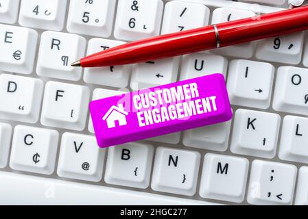 Text sign showing Customer Engagement. Word for communication connection between a consumer and a brand Creating Online Chat Platform Program, Typing Stock Photo