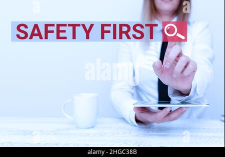 Writing displaying text Safety First. Word for used to say that the most important thing is to be safe Developer Discussing Gadget Upgrade, Presenting Stock Photo